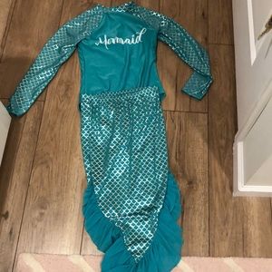 Girl’s one piece swimsuit with skirt size: L